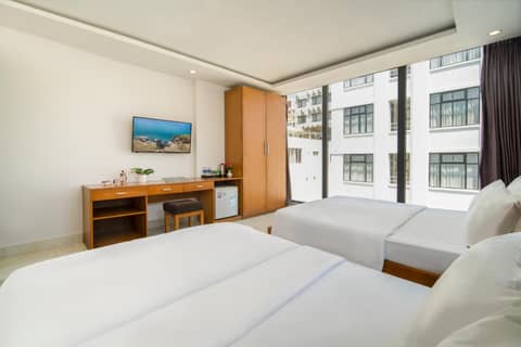 Trang Ngan Hotel by THG — hotel room