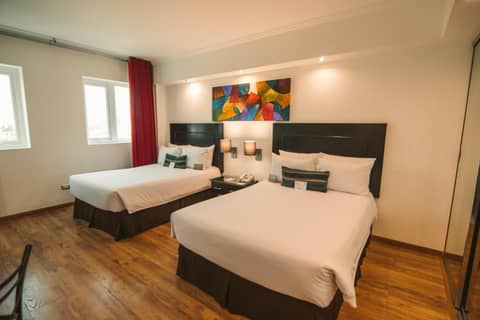 El Polo Hotel & Suites — hotel room
